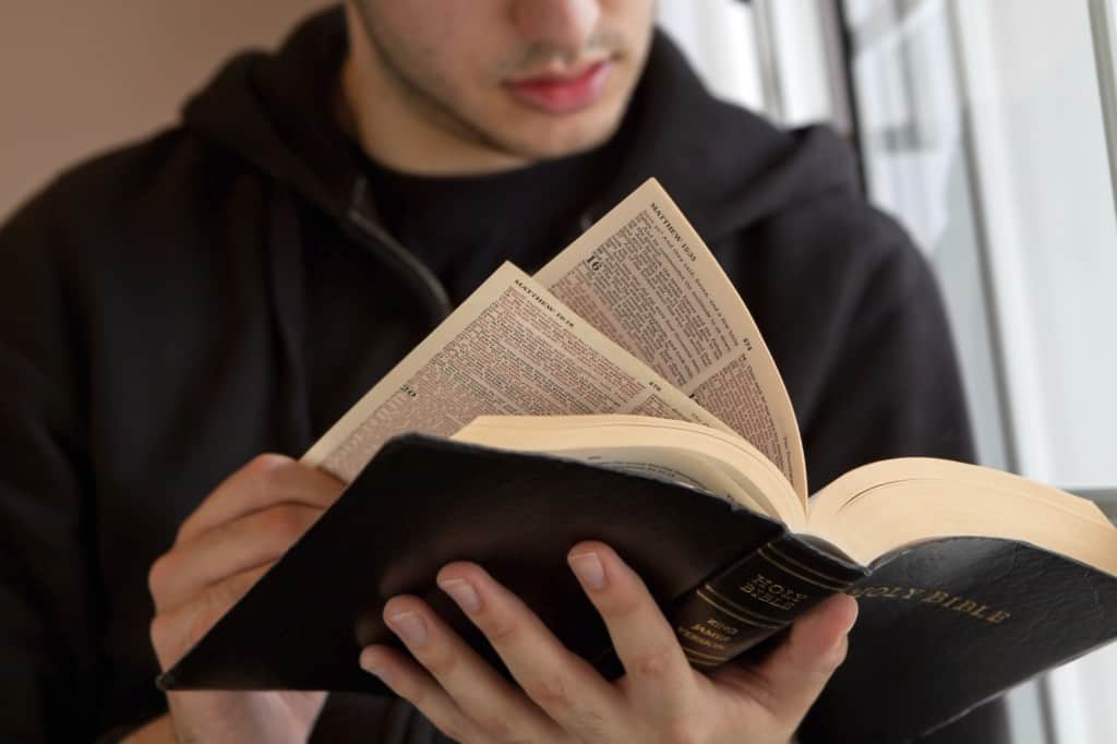 Young man reading the Bible